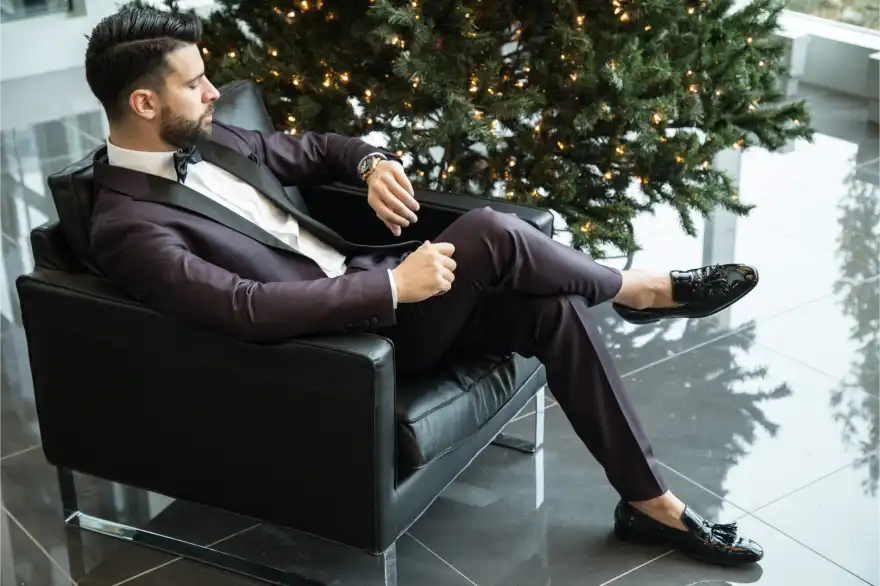 man sit on armchair